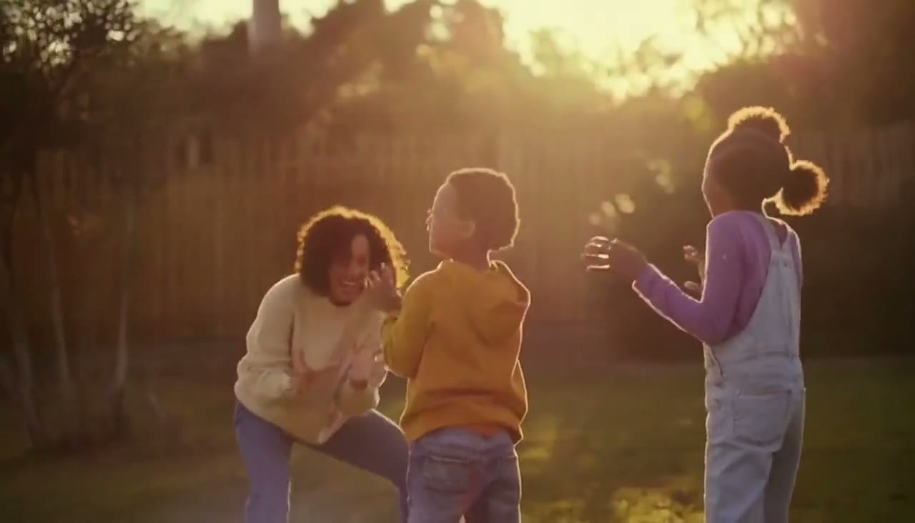 A family enjoying time together at home at golden hour